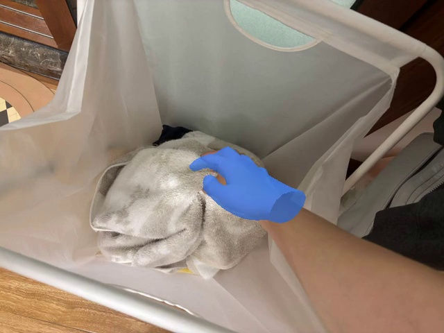 Pick the towel up from the laundry basket