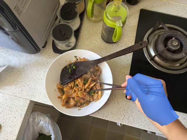 Pick up the food from the bowl with chopsticks