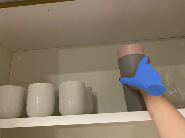 Pick up the gray cup from the cabinet