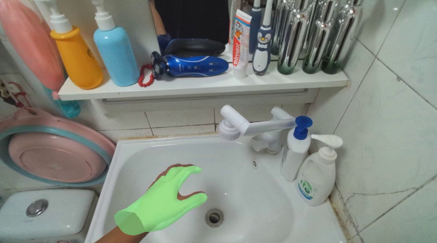 Pick up the soap dispenser with blue cap