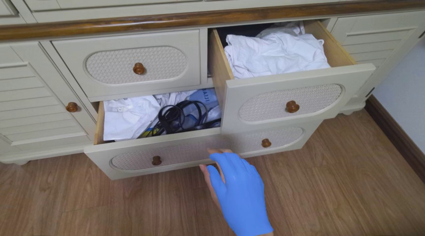 Pick up the white clothes in the upper drawer