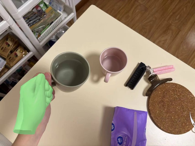 Pour the water into the pink cup