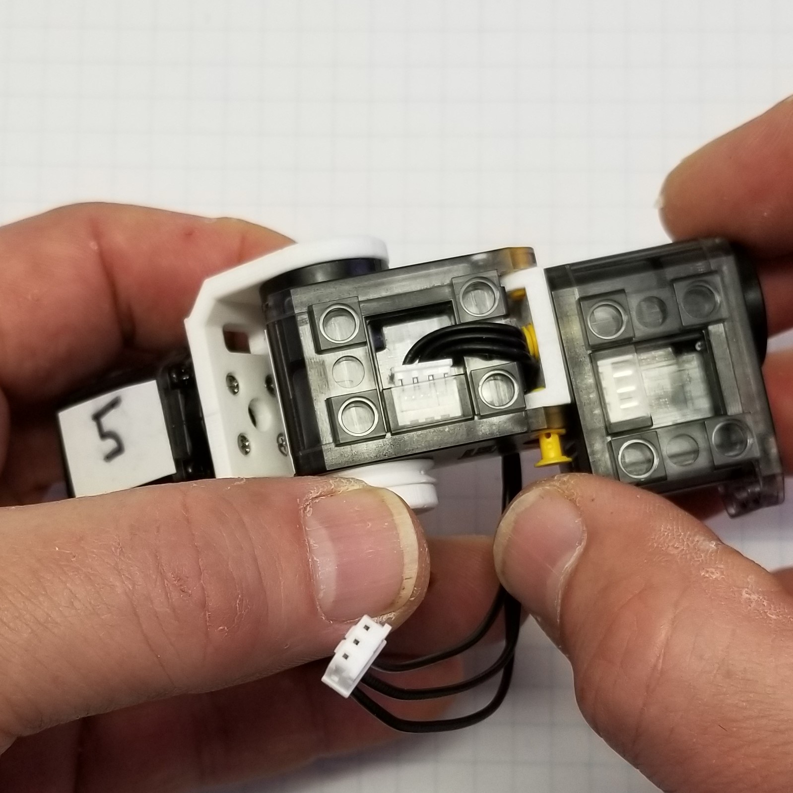 attach servo6 to servo7 and route cable through mount plate