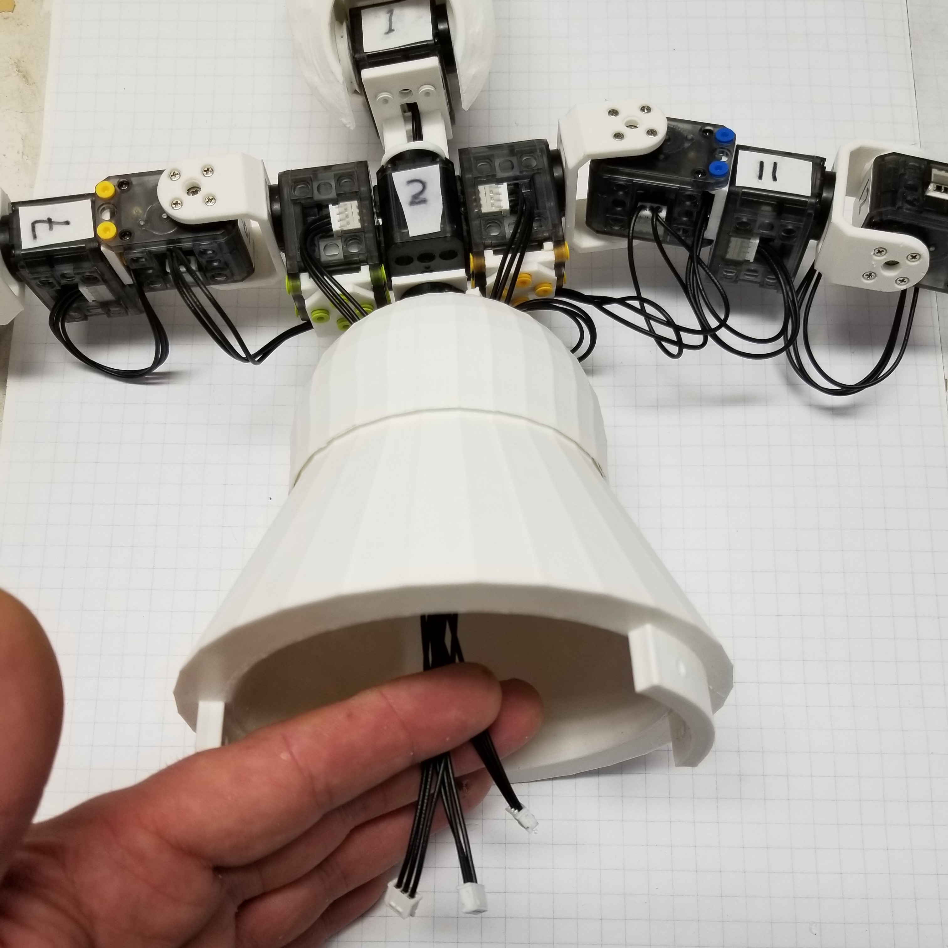 route long and short cables through base frame