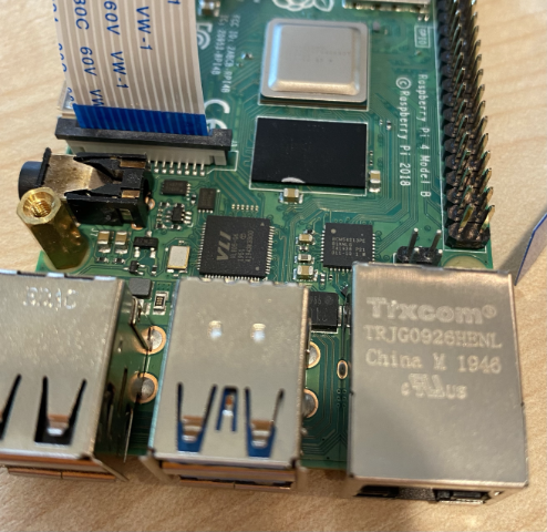 The camera cable connected to the Pi