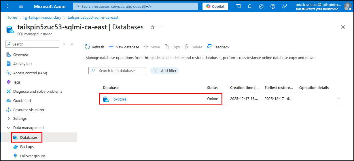 The databases page on the new primary SQL MI is displayed, with the ToyStore database listed.